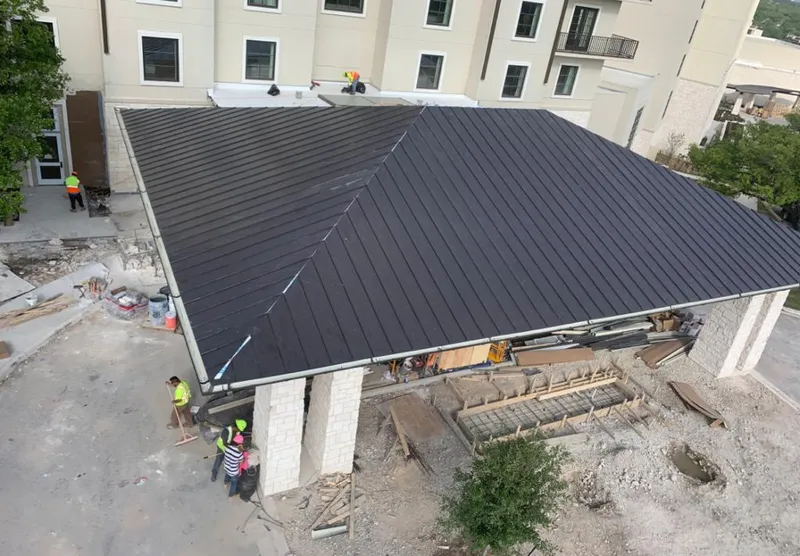 Metal roofing installation team working on a commercial building in Difficult Run